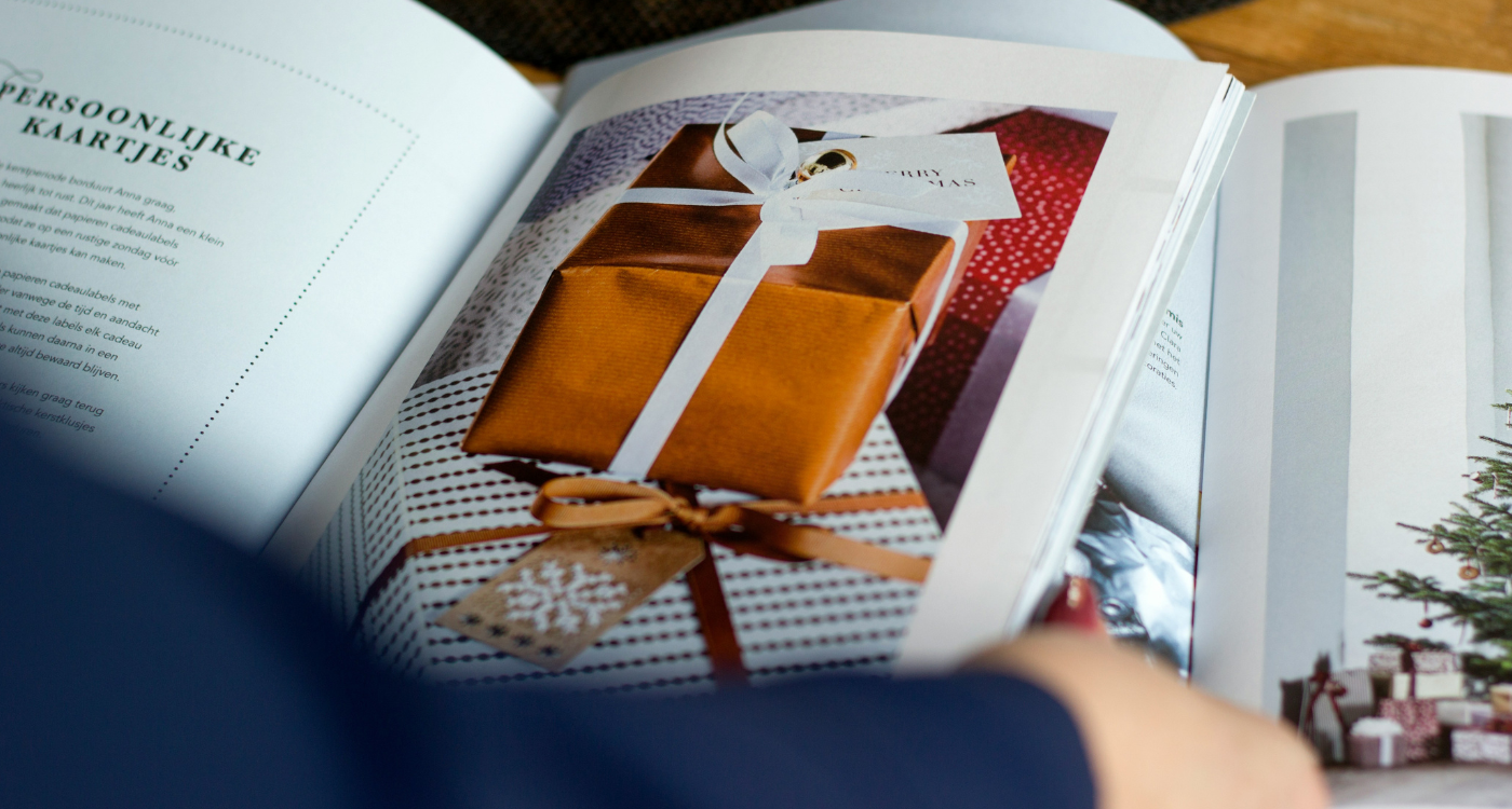 an image of a golden wrapped gift on the pages of an open book