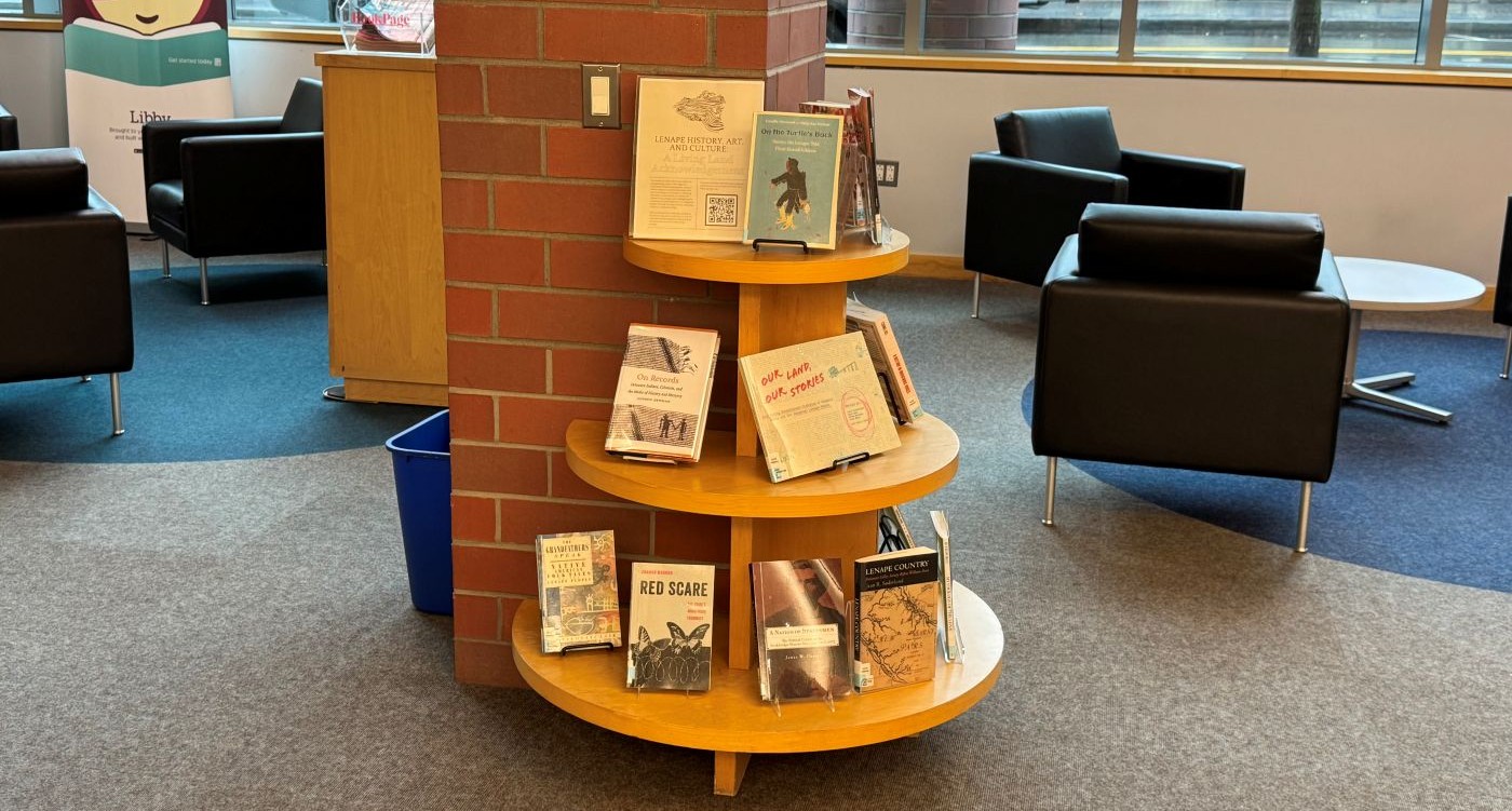 A photo showing the round display with the living land acknowledgement collection on it.