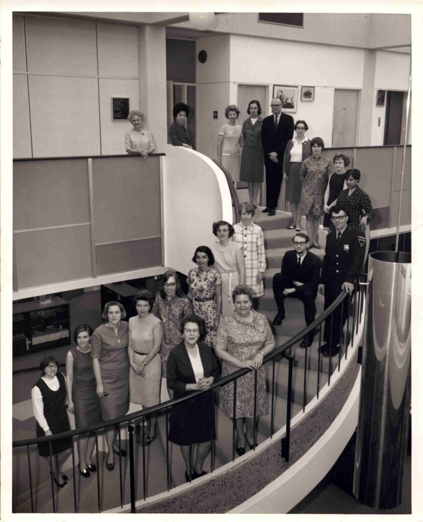 Librarians gathered on the staircase at the library in 1968.