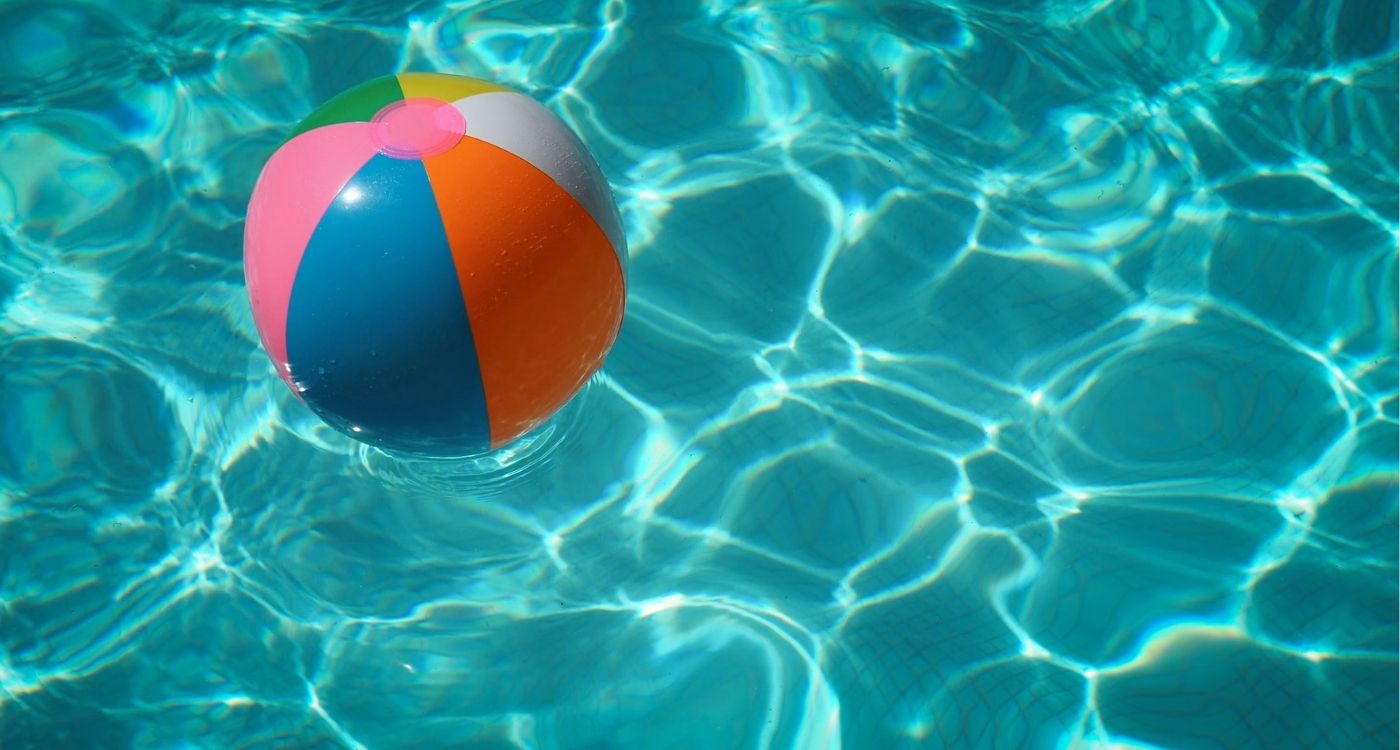 Beach ball floating in a pool